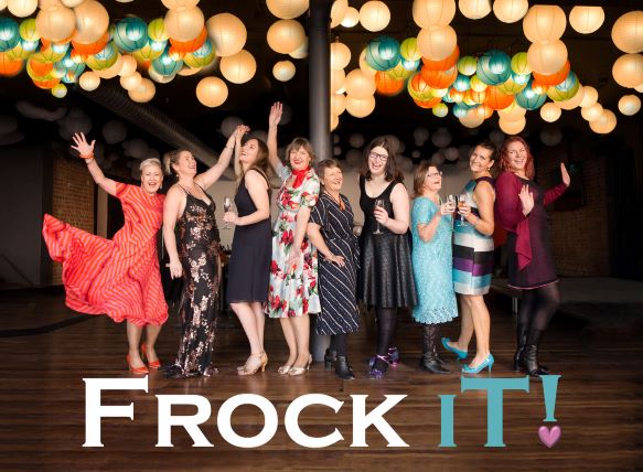 Frock IT! - women in dresses dancing, laughing, and holding glasses of champagne